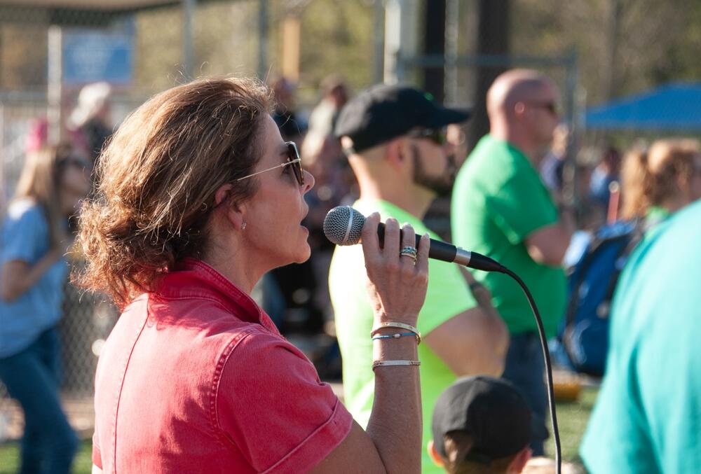 Lori Gregory singing the National Anthem.