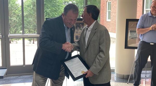 Mayor Adams presenting proclamation to Dr. Robin Myers