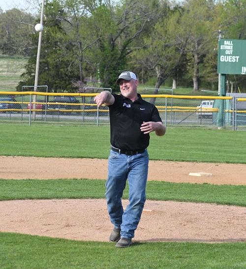 Man throwing baseball from the pitcher's mound