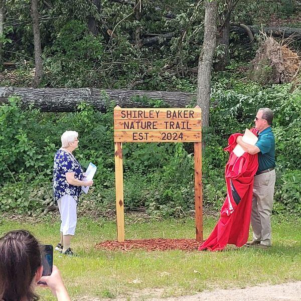 Mayor Adams and Ms. Baker at Trail Head with new sign.