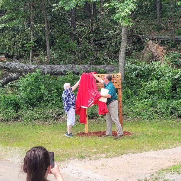 Mayor Adams and Ms. Baker unveiling trail sign