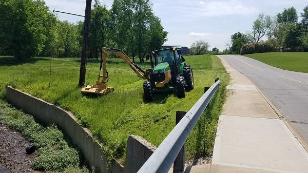 Mowing right of way at creek on Cardinal Drive