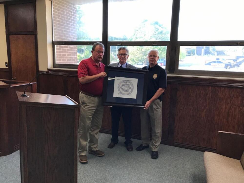 Mayor Adams and Police Chief Manuel receiving accreditation