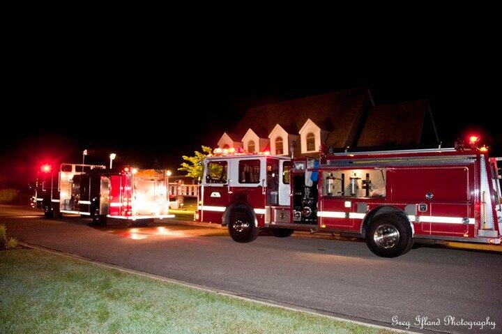 Two firetrucks in front of a home