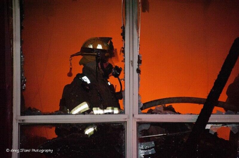 Fireman inside engulfed structure