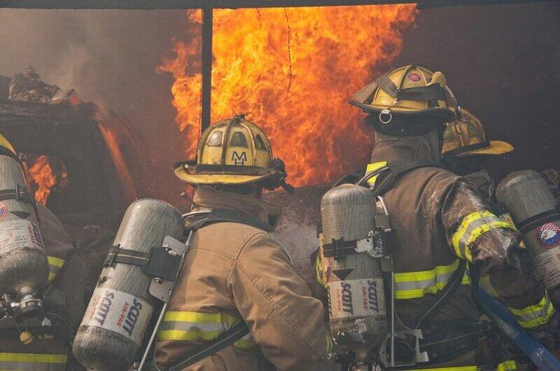 Group of firemen fighting large blaze