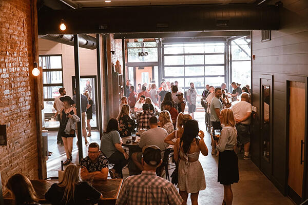 group of patrons inside Rapp's Barren Brewery