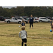 Youth soccer players running after the ball.