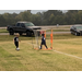 Youth soccer player kicking ball.