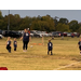 Youth soccer coach instructing team.