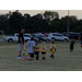 Youth soccer players with their coach.