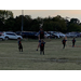 Youth soccer players prepping to start game.